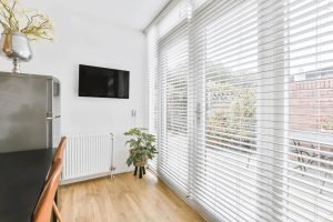 Narrow small room with large sliding windows to the floor